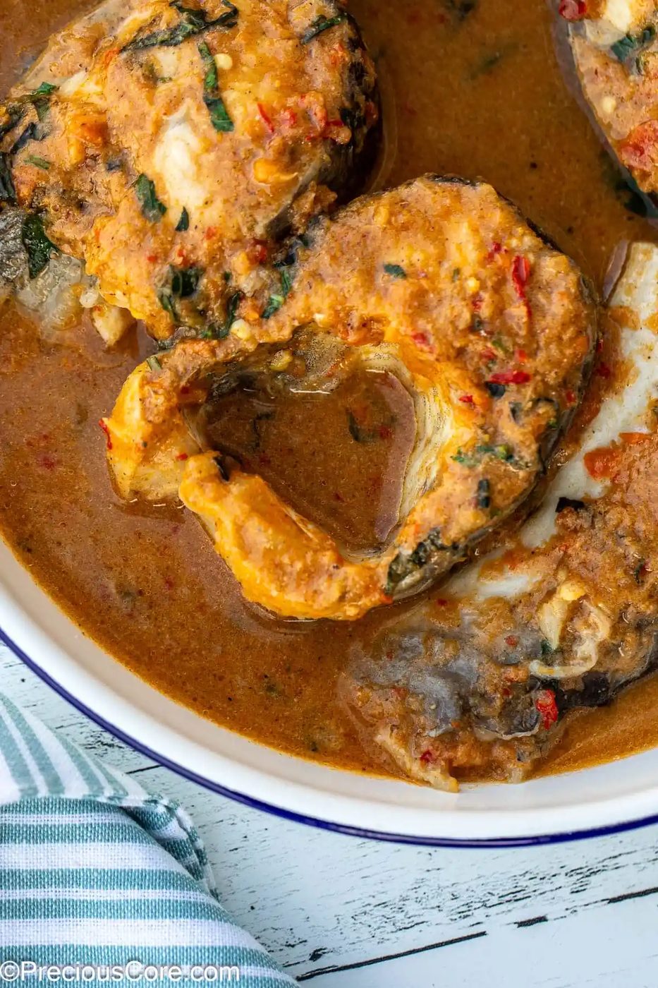 Close-up of fish steaks in a broth.