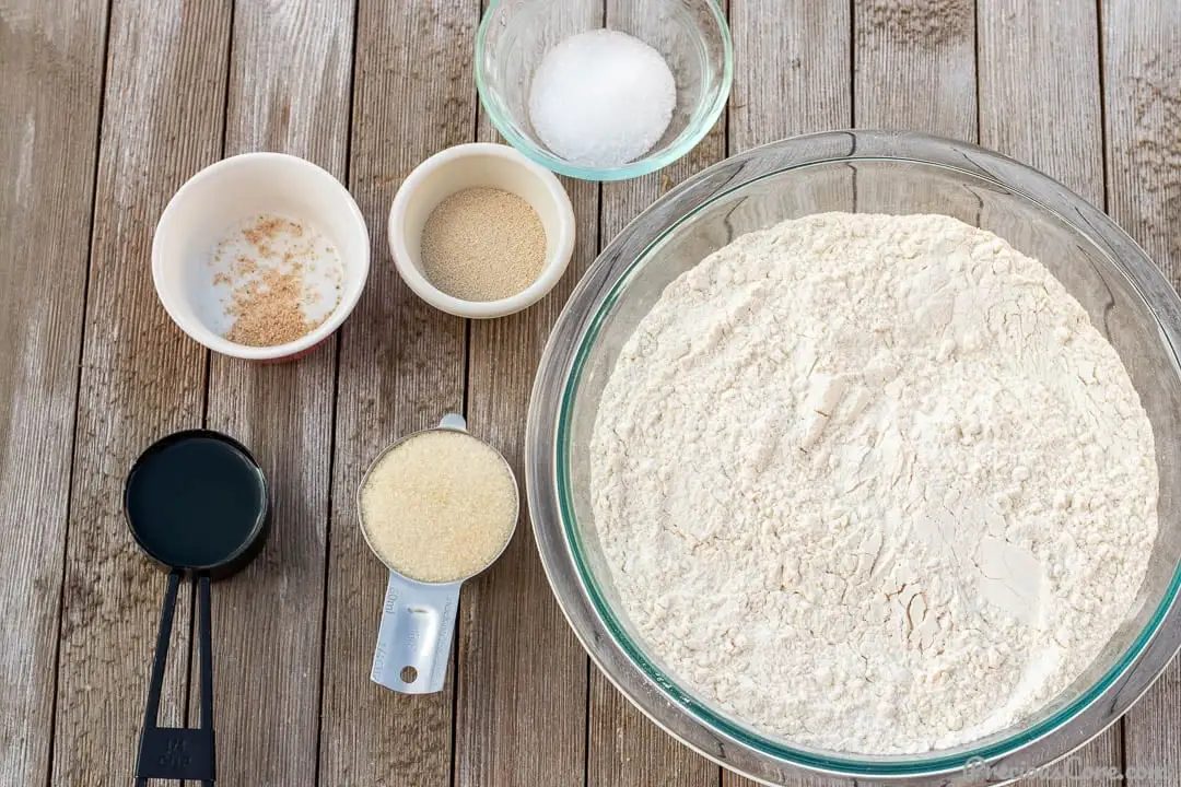 Ingredients for Easy Sandwich Bread Recipe in bowls and measuring cups.