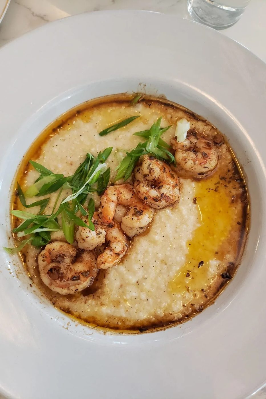 A plate of shrimp and grits at a restaurant in Austin, Texas.
