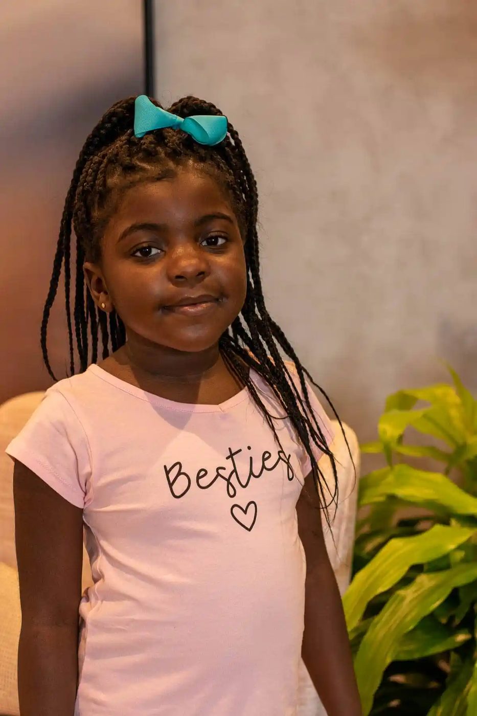 Our daughter in a pink t-shirt.