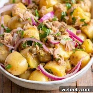 A close up of a tuna potato salad in a bowl