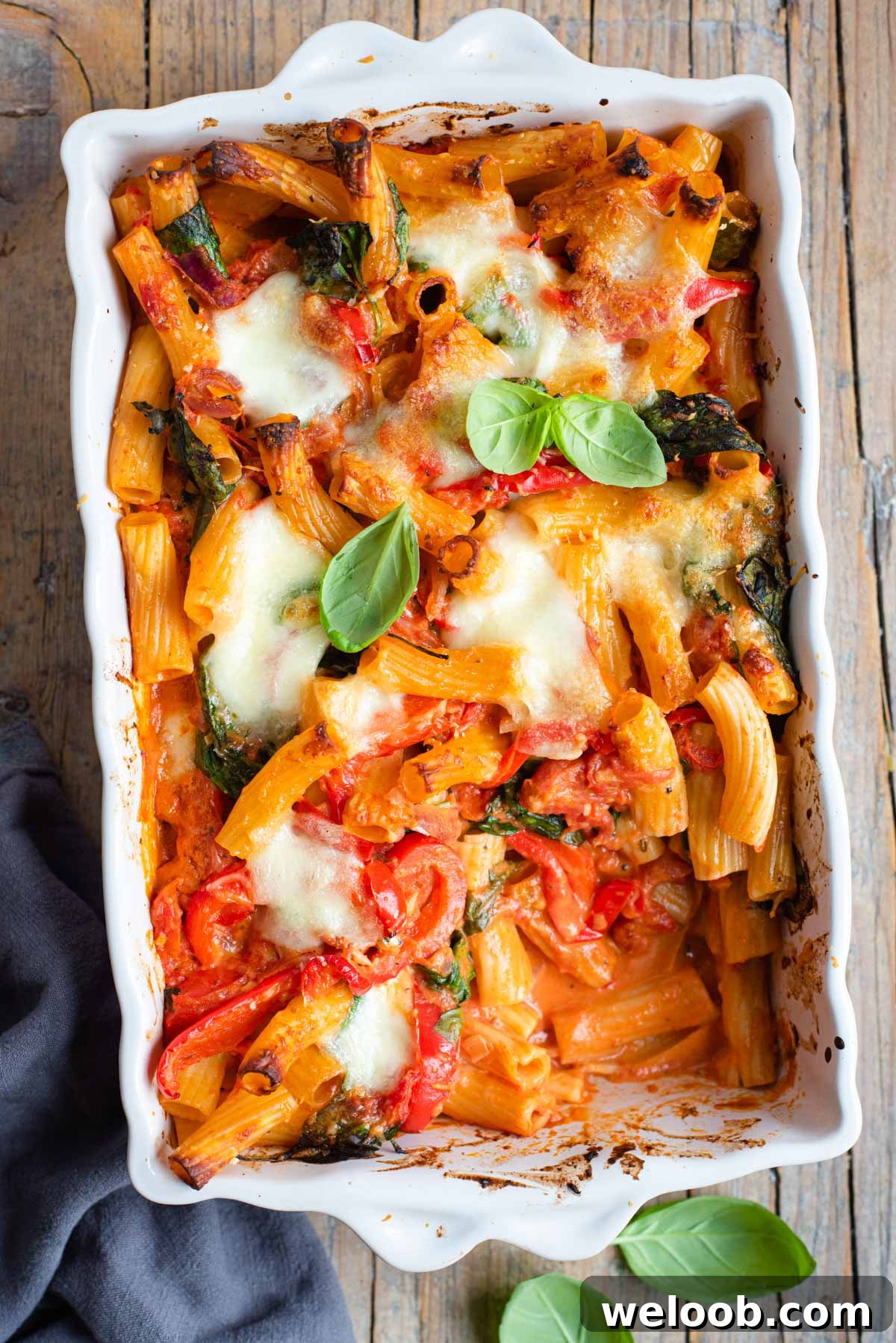 An overhead shot of vegetarian baked ziti in a casserole dish