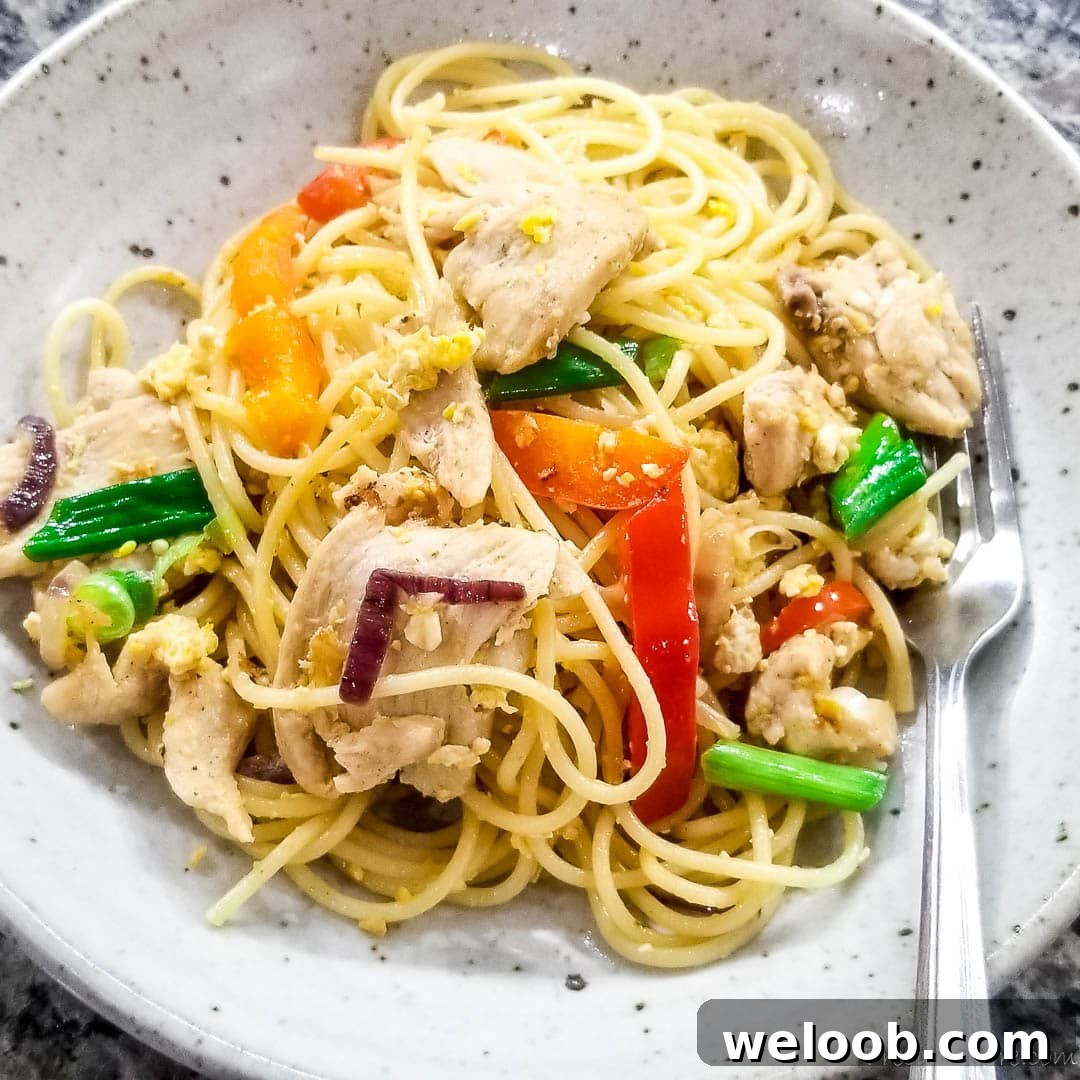 spaghetti stir fry on a plate