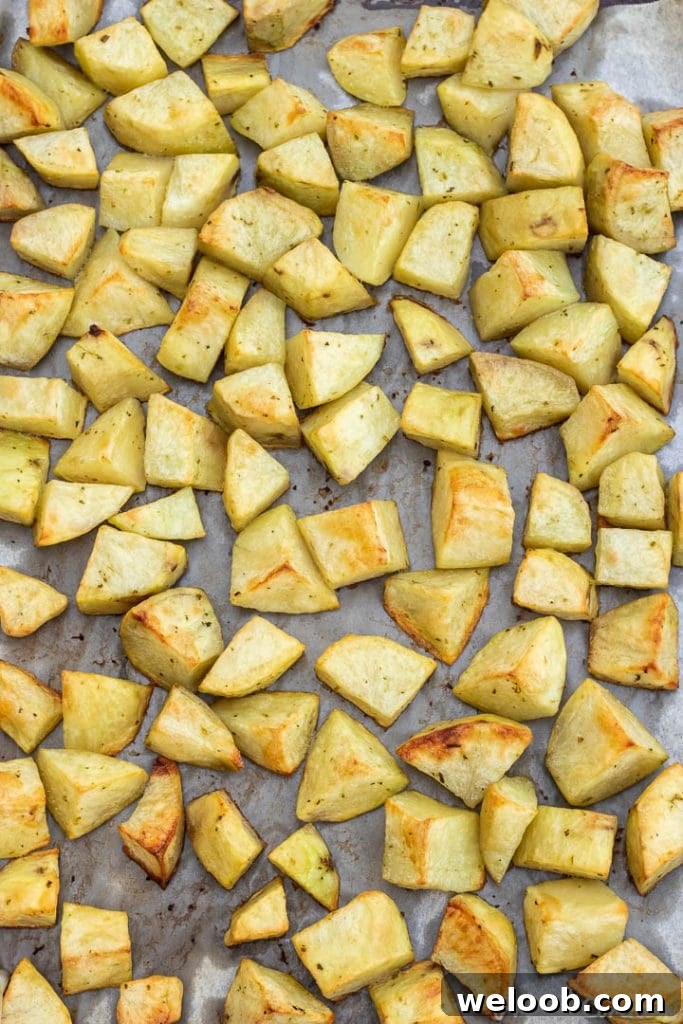 easy roasted potatoes on baking sheet lined with parchment paper