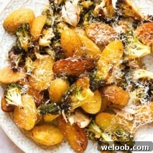 A close up of roasted potatoes and broccoli