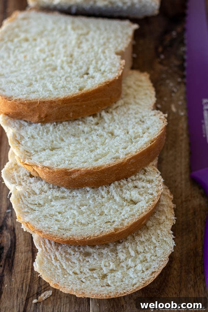 Slices of homemade sandwich white bread on a chopping board.