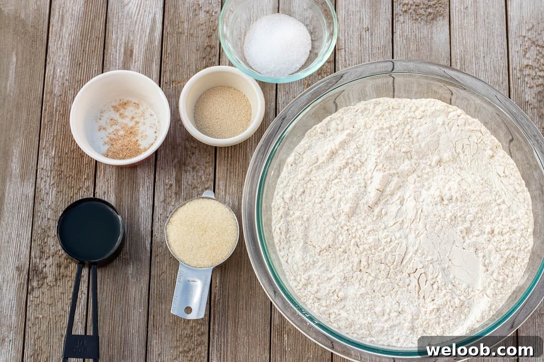 Ingredients for Easy Sandwich Bread Recipe in bowls and measuring cups.