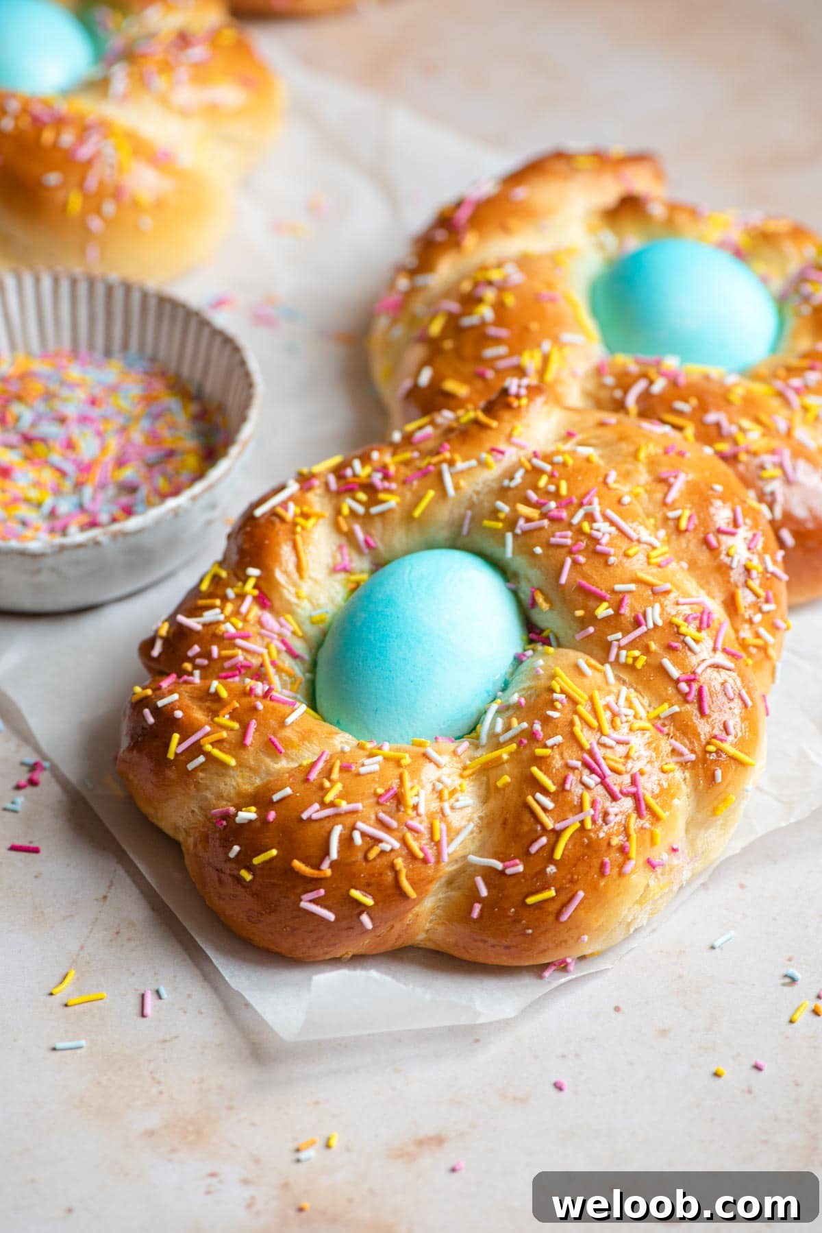 Italian Easter bread with a blue egg in the middle covered with sprinkles