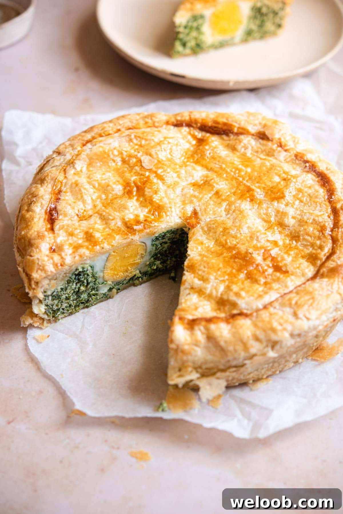 Torta Pasqualina with a slice cut out