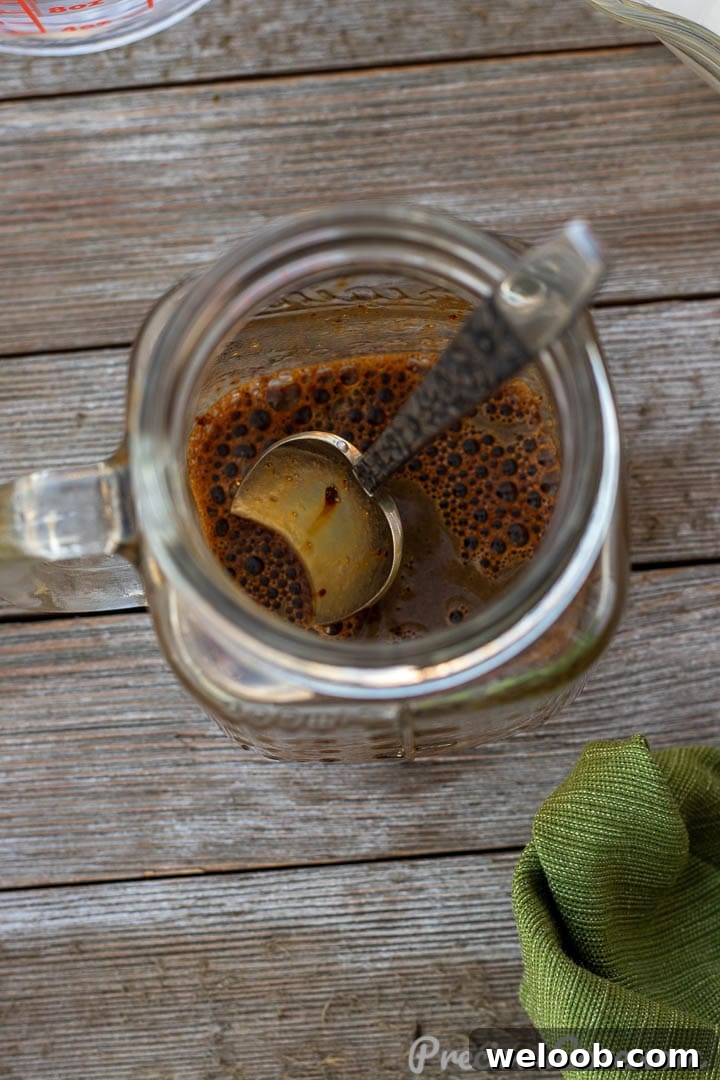 Instant coffee dissolved in a little water in a mug