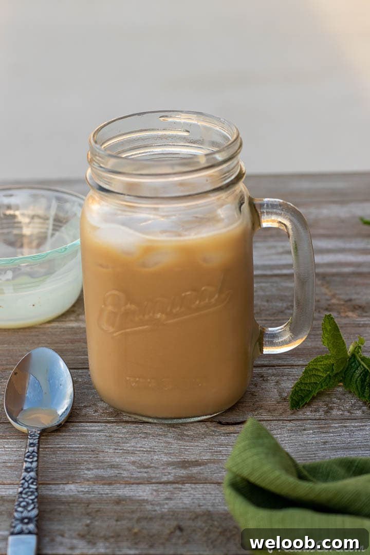 creamy iced coffee in a mason jar