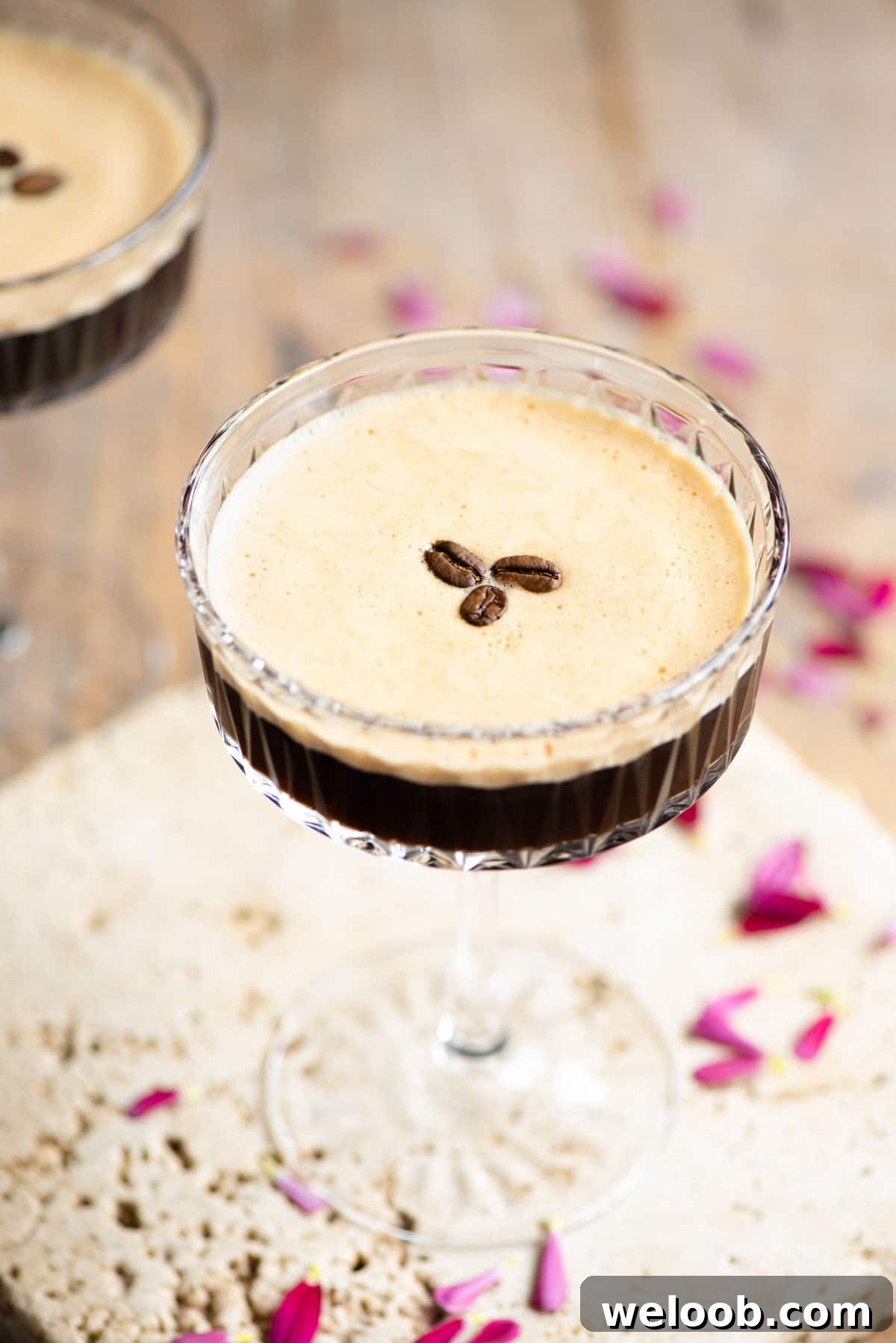 An espresso martini with 3 coffee beans on top