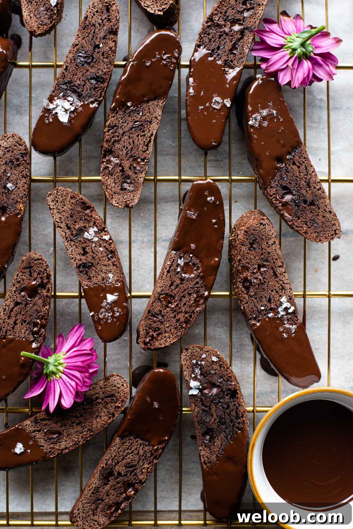 An overhead shot of chocolate biscotti on a cooling rack