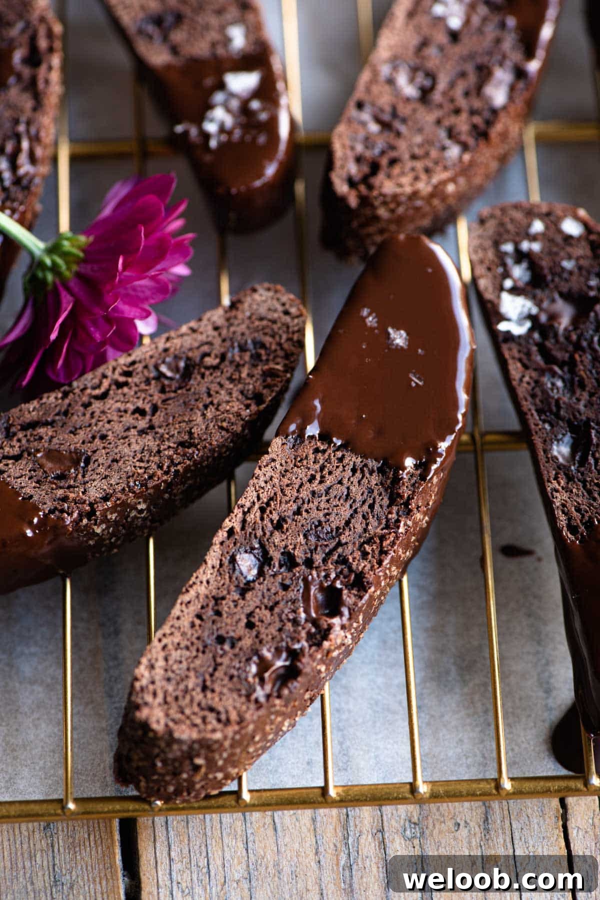 A close up of chocolate biscotti dipped in chocolate