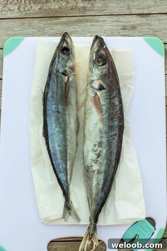 2 whole fish on cutting board
