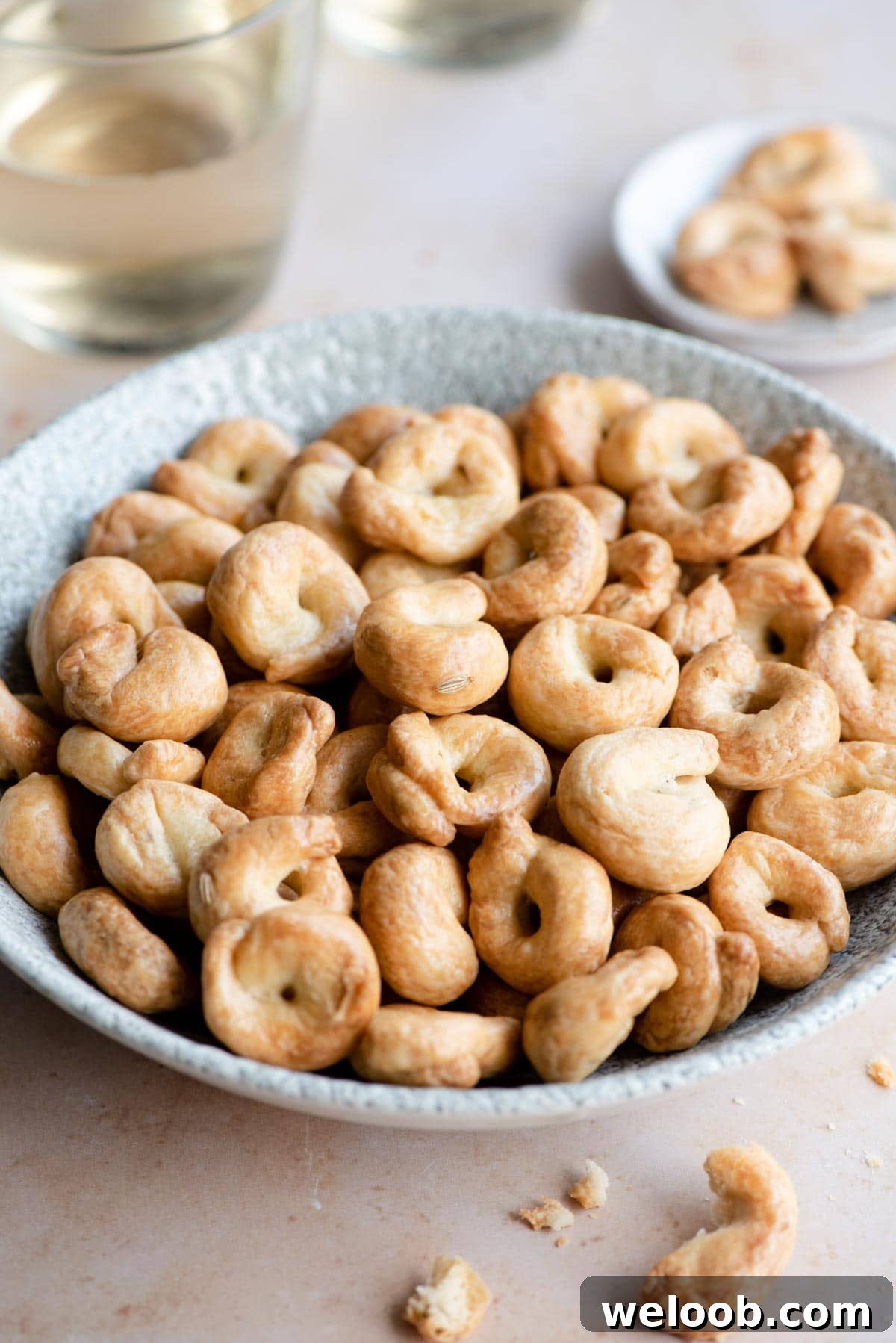 A side shot of Italian taralli in a serving bowl