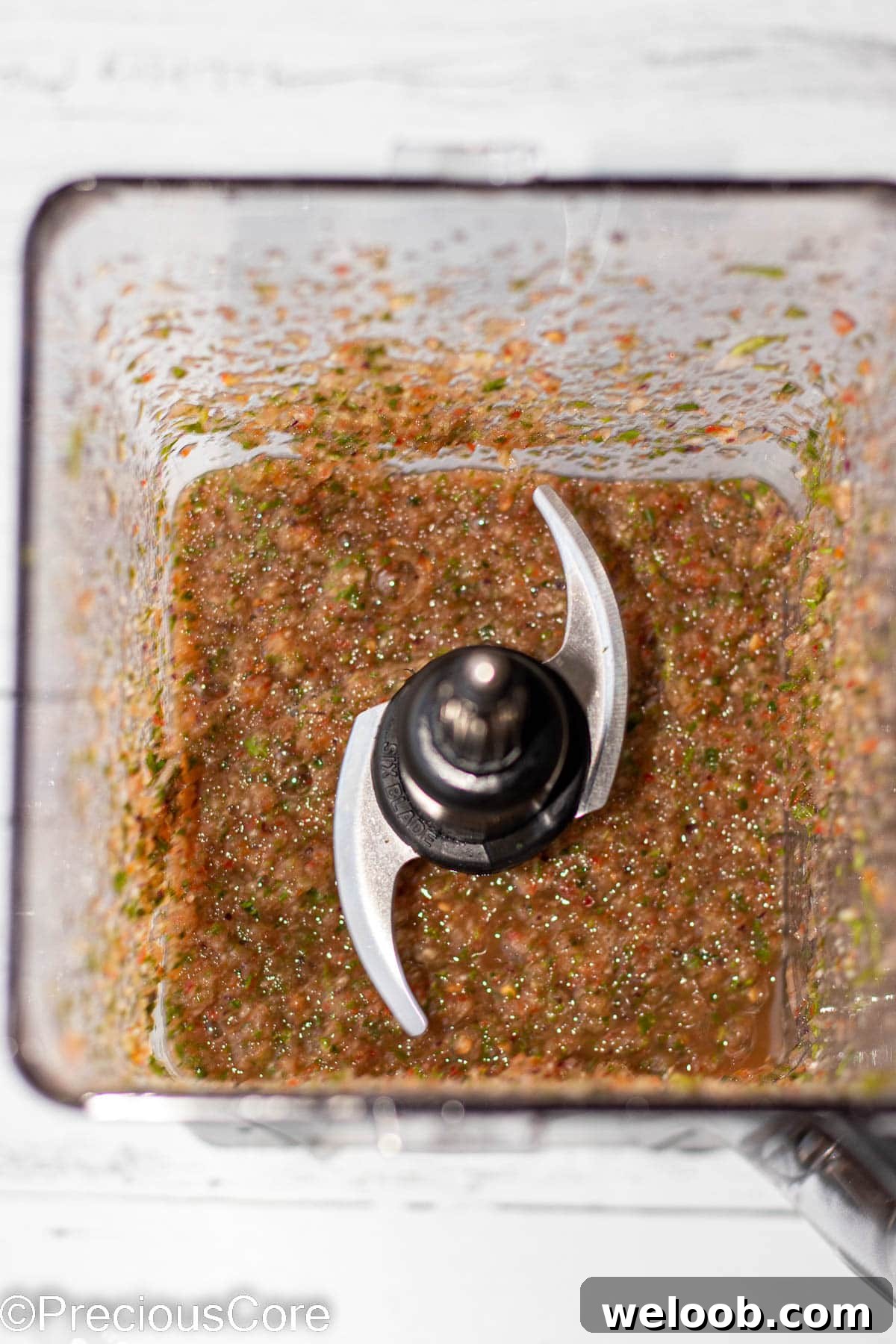 Pepper sauce ingredients blended in a blender.