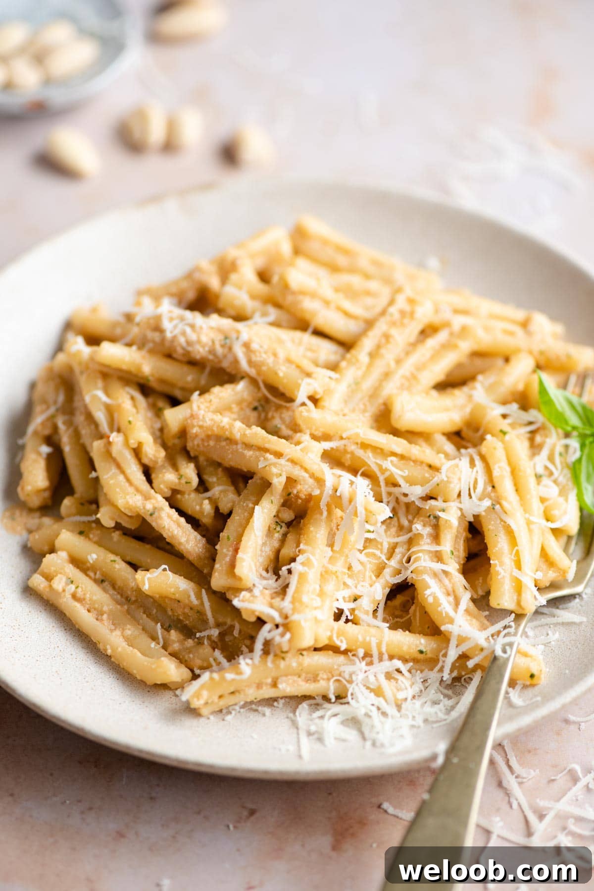 A close up of pesto alla trapanese mixed with pasta