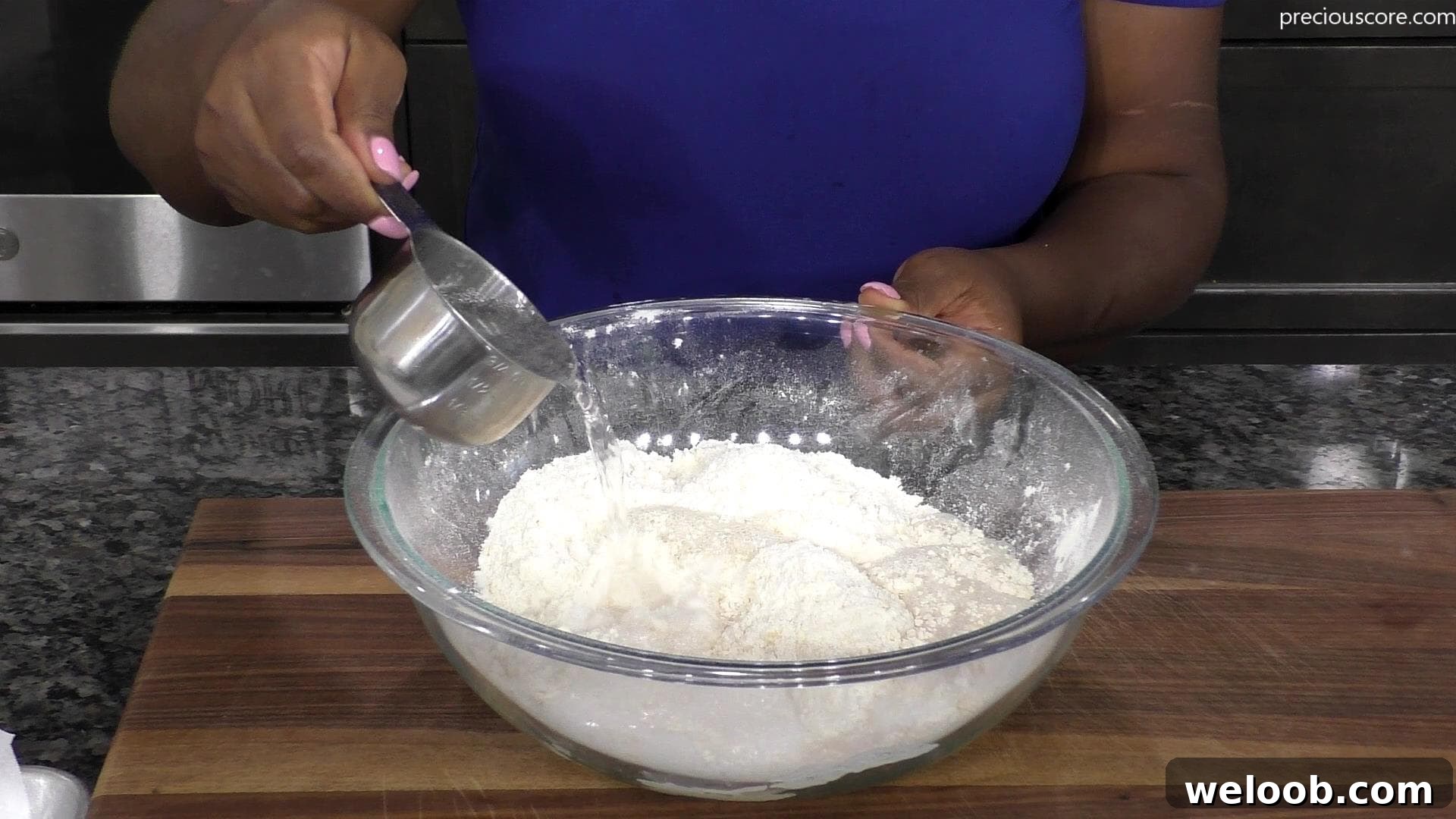 Hand pouring Sprite into mixing bowl.