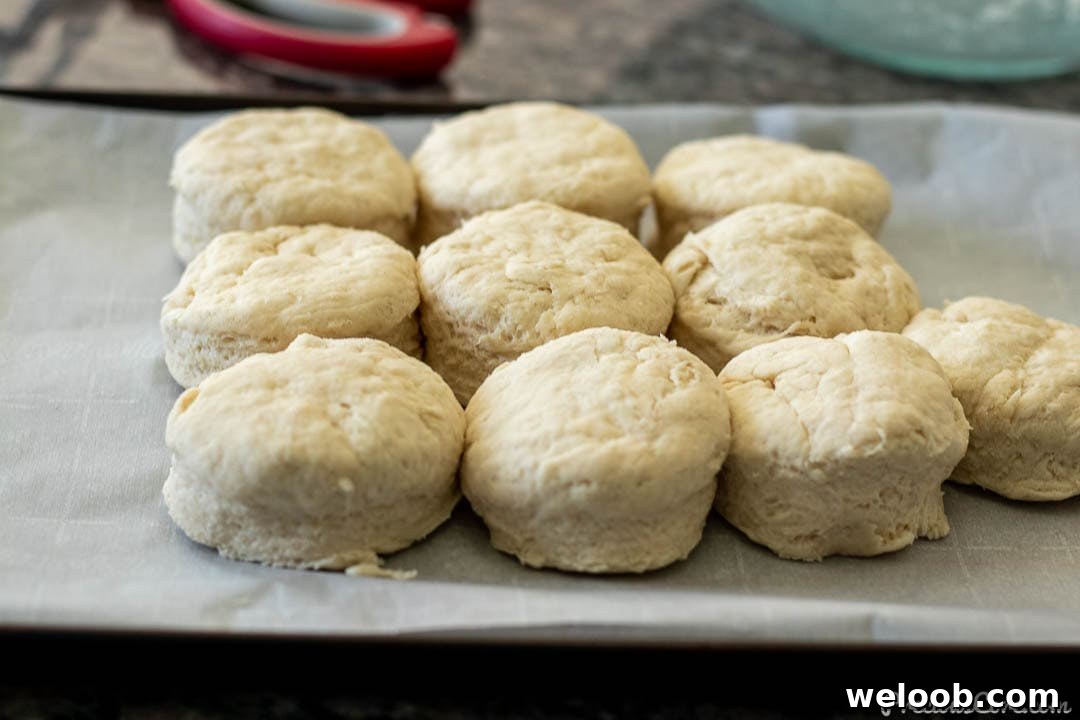 raw biscuit dough on baking sheet