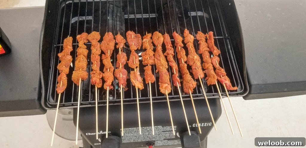 Skewered beef on a grill