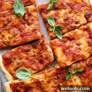 An overgead shot of a focaccia pizza cut into slices