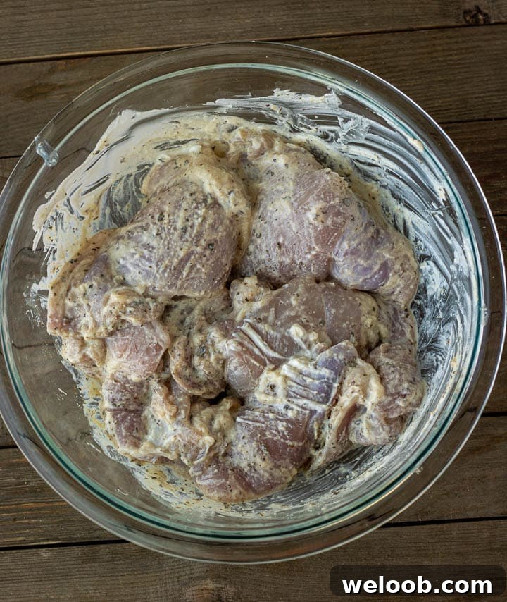 Chicken thighs marinating in yogurt