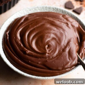 A close up of chocolate pastry cream in a bowl
