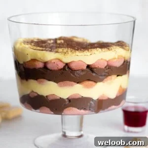 A close up of zuppa inglese in a glass trifle dish