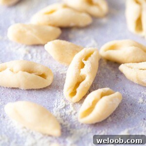 A close up of fresh cavatelli pasta on a blue work surface