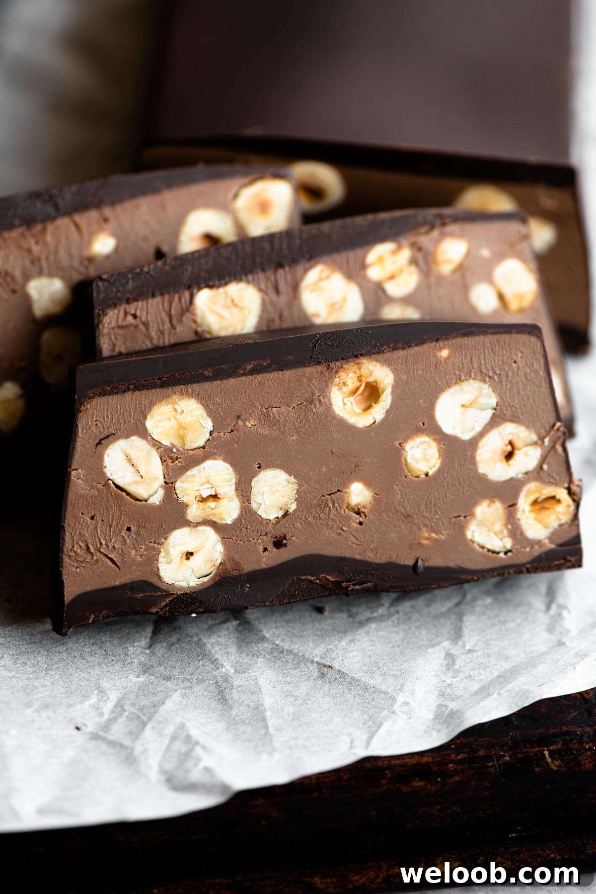 A close up of a chocolate hazelnut torrone cut into slices
