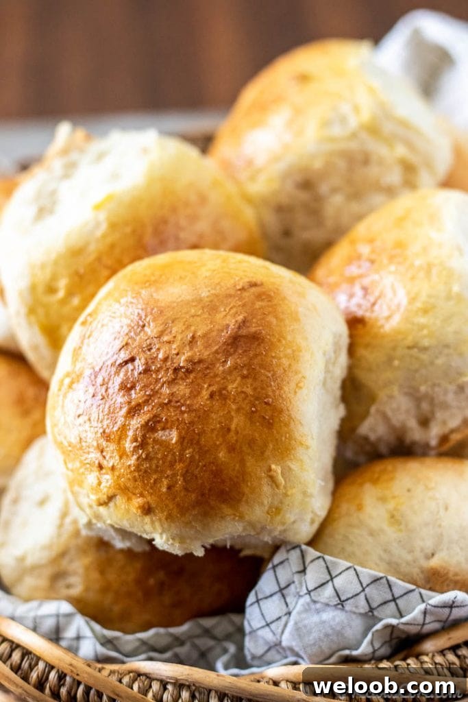 close up of a dinner roll in a basket