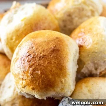 close up of a dinner roll in a basket
