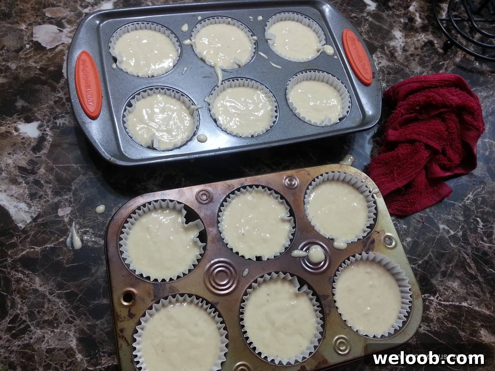 Muffin pans full of banana cake batter.