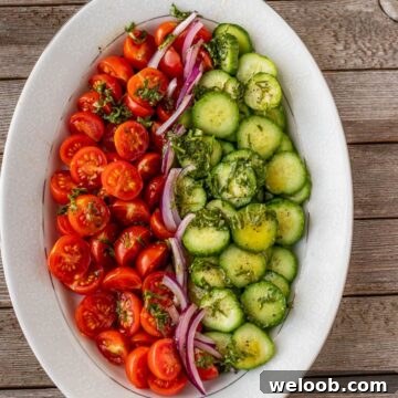 tomato cucumber salad on a platter