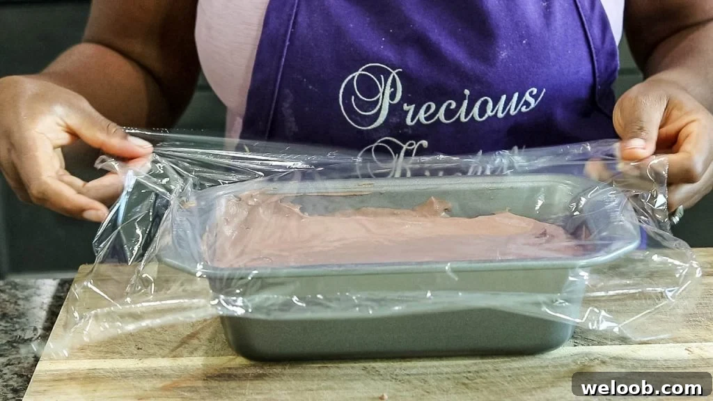 Covering ice cream mixture with plastic wrap