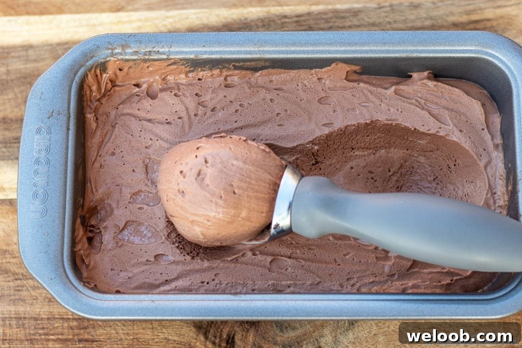 Scoop of ice cream in loaf pan filled with ice cream