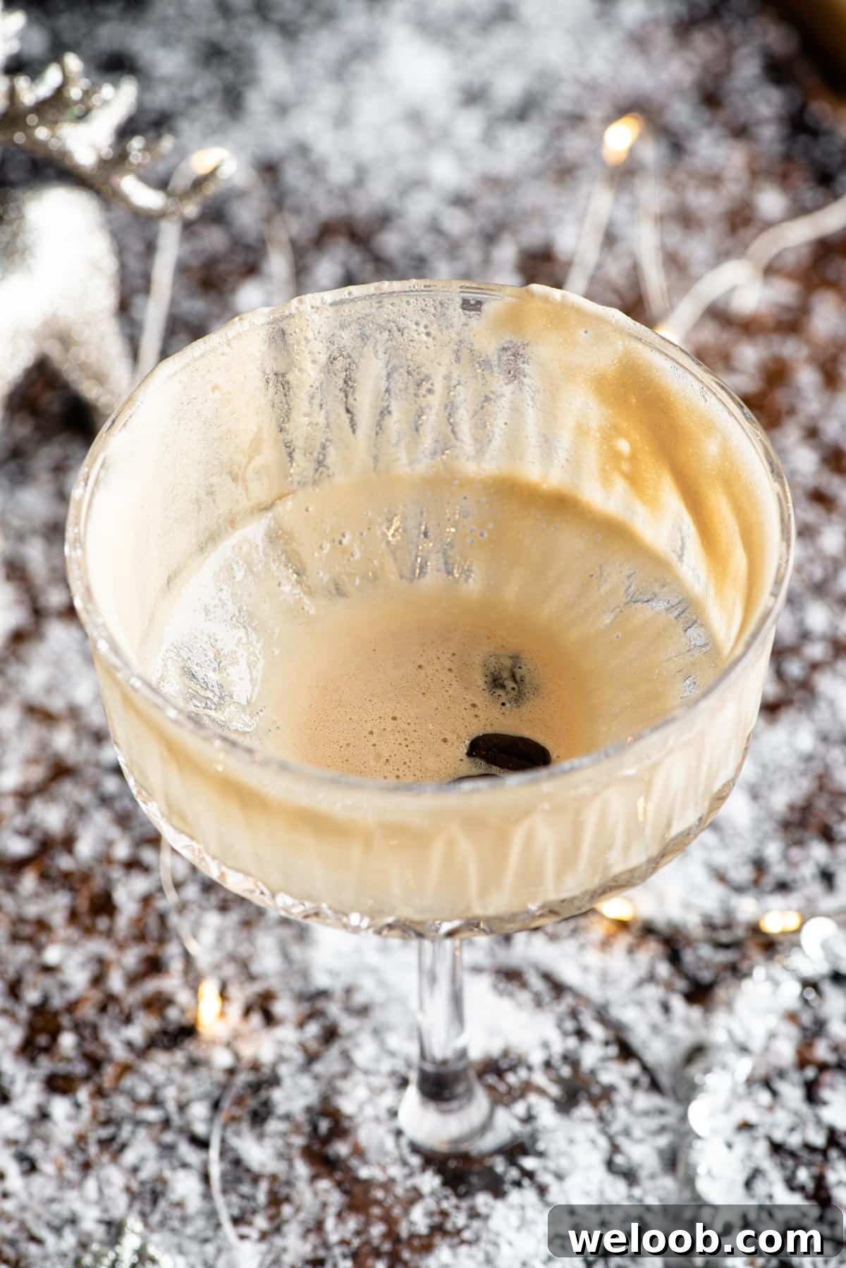 A close up of an empty martini macchiato cocktail