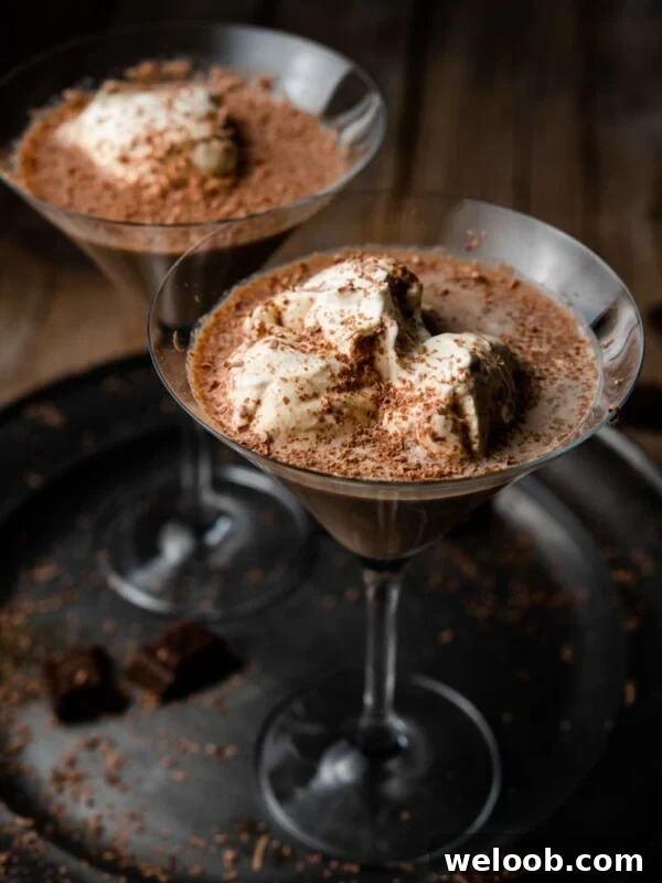 A close up of a chocolate martini on a pewter plate