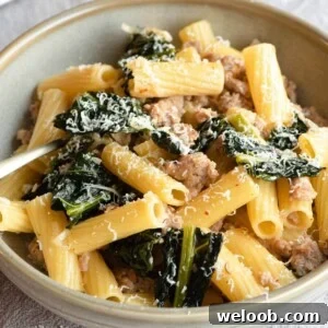 A close up of sausage and cavolo nero pasta in a bowl