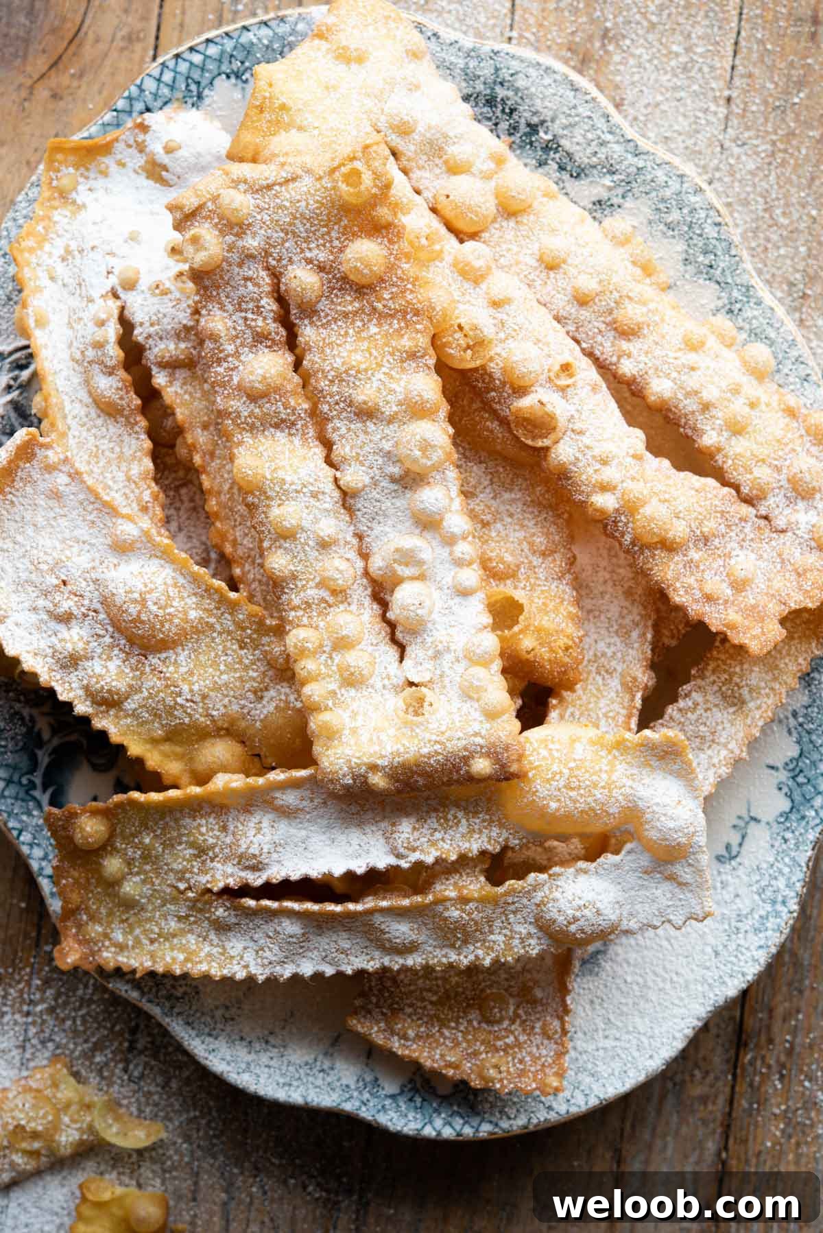 An overhead shot of Cenci Italian pastries on a blue plate