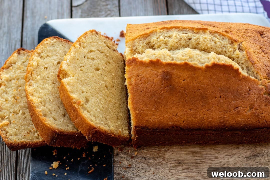 Pound Cake on cutting board with some slices.