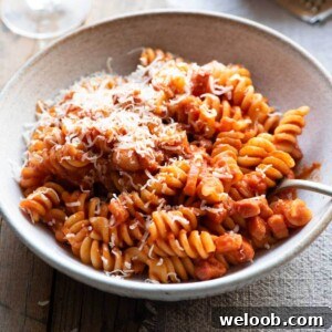 A close up of a creamy tomato pasta in a bowl