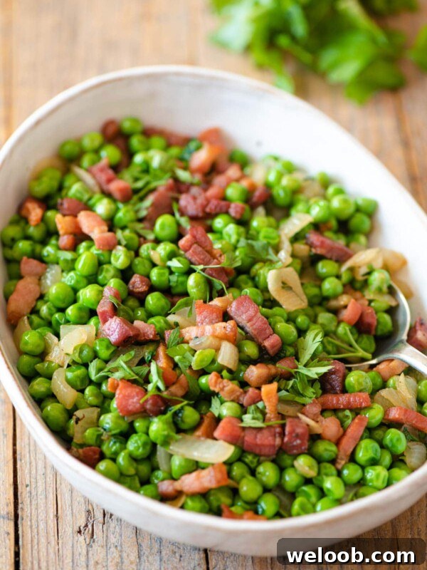 Peas and pancetta in a large serving bowl