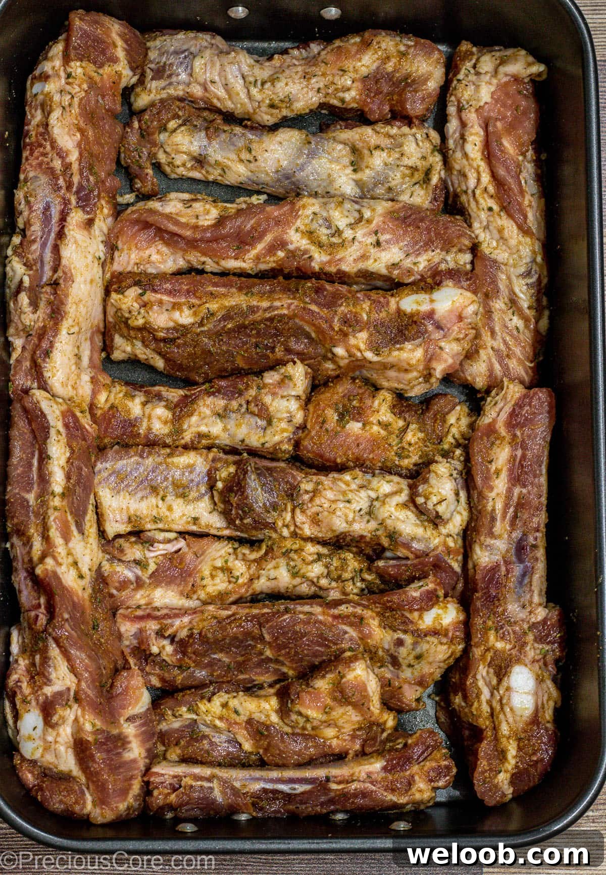 Seasoned Ribs in baking dish.