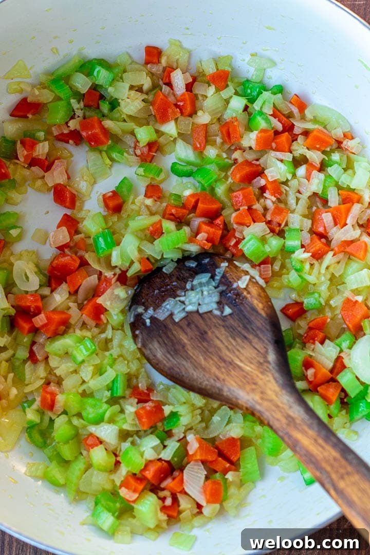 Pot with sauteed onions, garlic, carrots and celery
