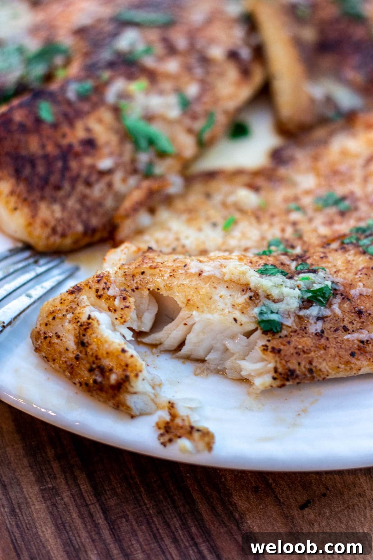 Flaky Lemon Butter Tilapia fish.