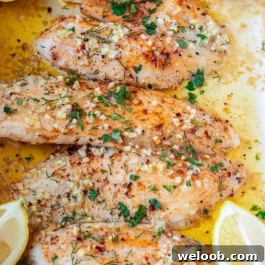 Square image of baked lemon butter tilapia.