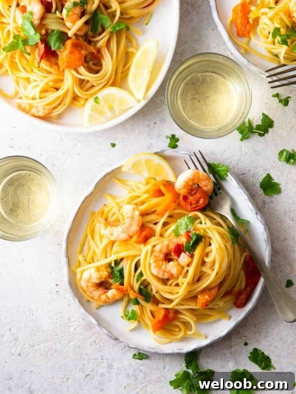 An overhead shot of shrimp linguine on a plate with parsley