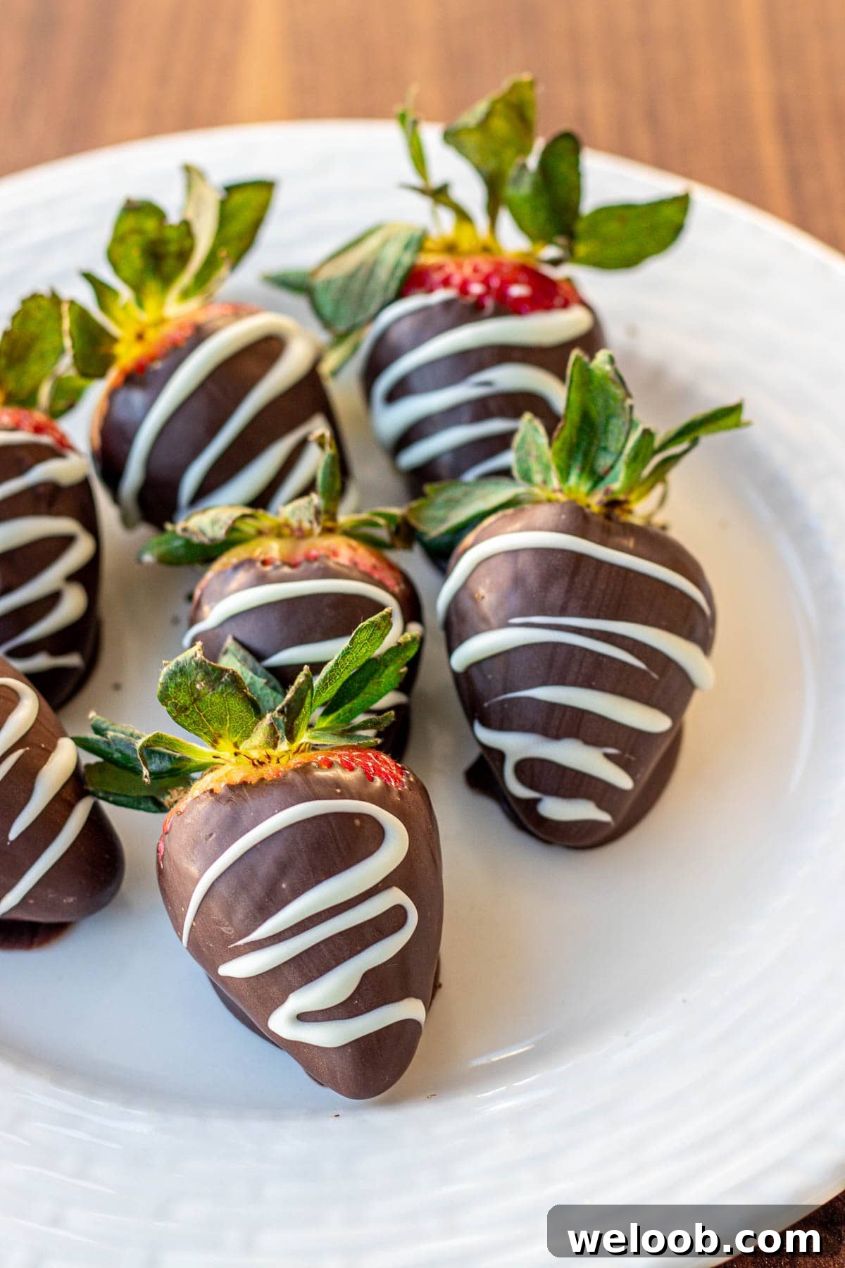 chocolate covered strawberries drizzled with white chocolate